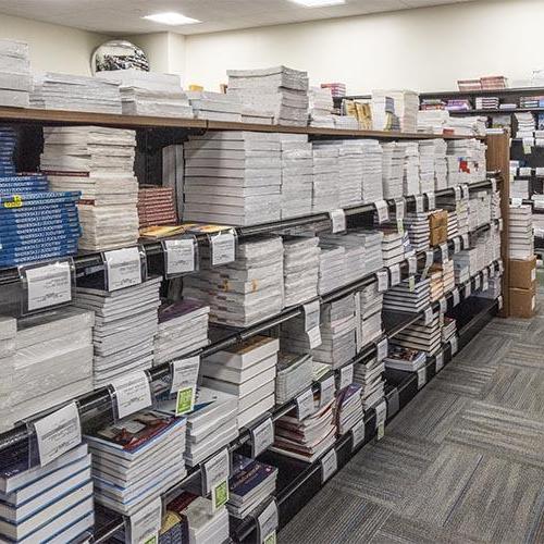 Textbooks on the shelves in the University of Mary bookstore.